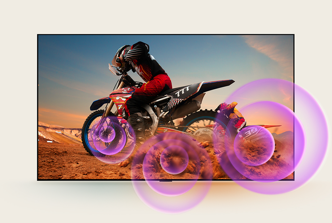 LG TV image with purple sound waves around a motorcycle rider illustrates Dynamic Sound Booster fuller audio.