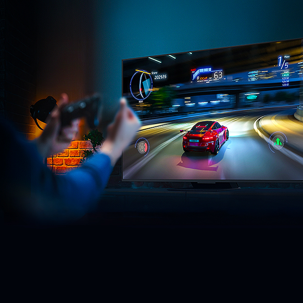 LG TV racing scene with VRR text illustrates variable refresh rate for smoother gameplay and reduced tearing.