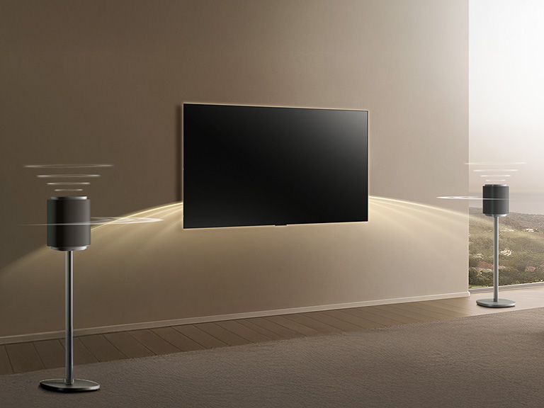 ' LG Sound Suite pair of speakers and soundbar placed with a TV, delivering rich surround sound system for TV with full Dolby Atmos
