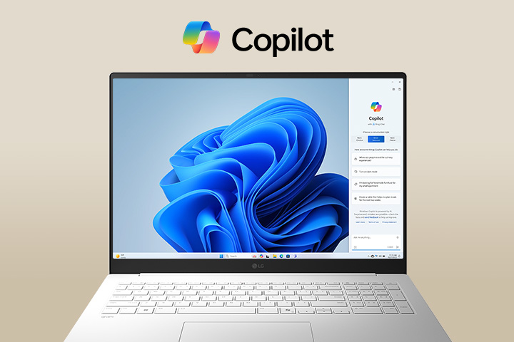 A laptop featuring the Windows Copilot logo above the screen and Windows Copilot interface on the display, showcasing a sleek design with a large screen and the Windows 11 interface in the background.	