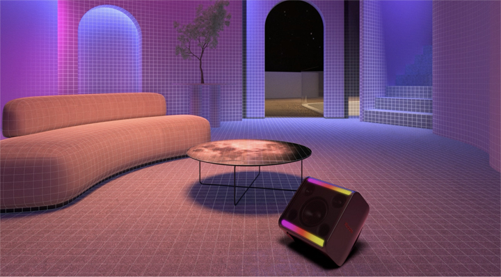 In a room equipped with a long sofa, a round table and a plant, xboom Stage 301 is placed In the front with its light on.