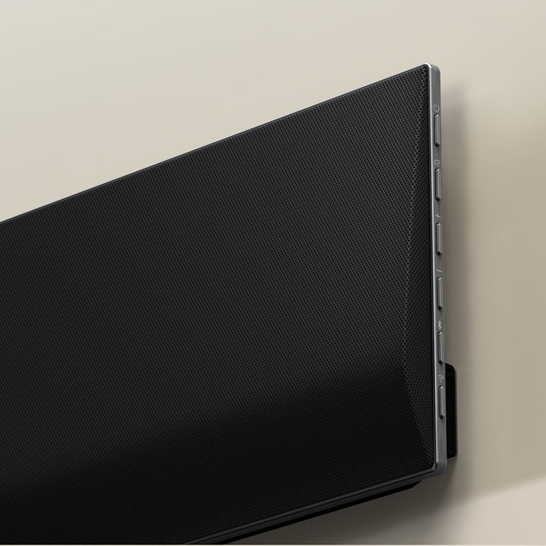 A close-up of the soundbar against the wall.
