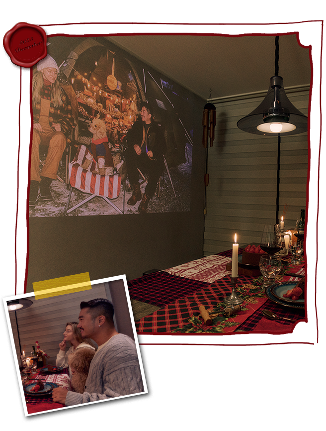 Couple viewing shared memories with an LG CineBeam projector	