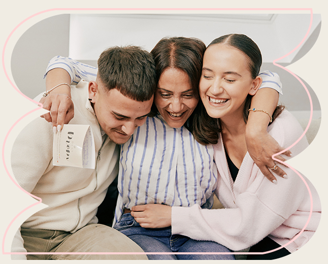 Touching moment of a moved mum and a happy family together	
