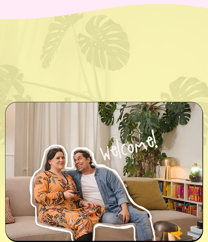 It's an image of a couple sitting on a couch watching TV.