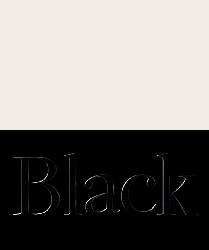 Word black embossed on a black background. 	