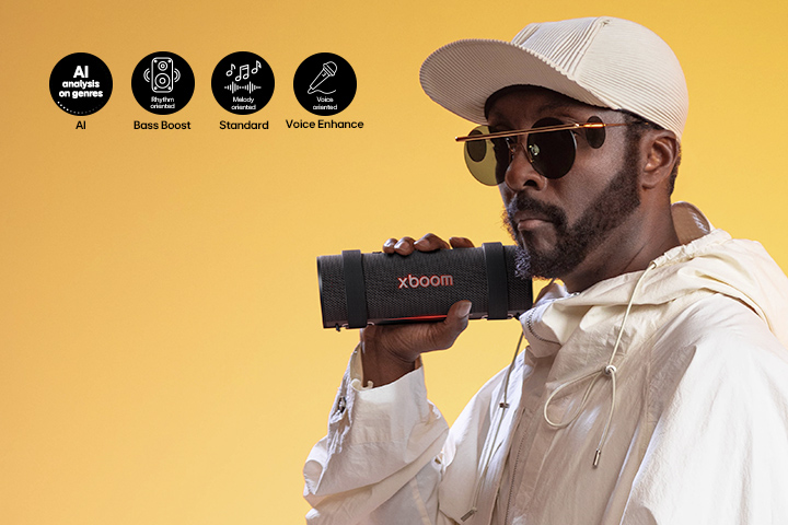 will.i.am is holding xboom Grab on his right hand.